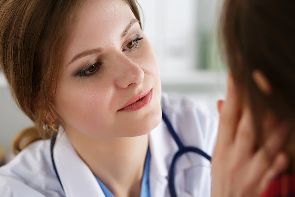 A doctor examining a patient