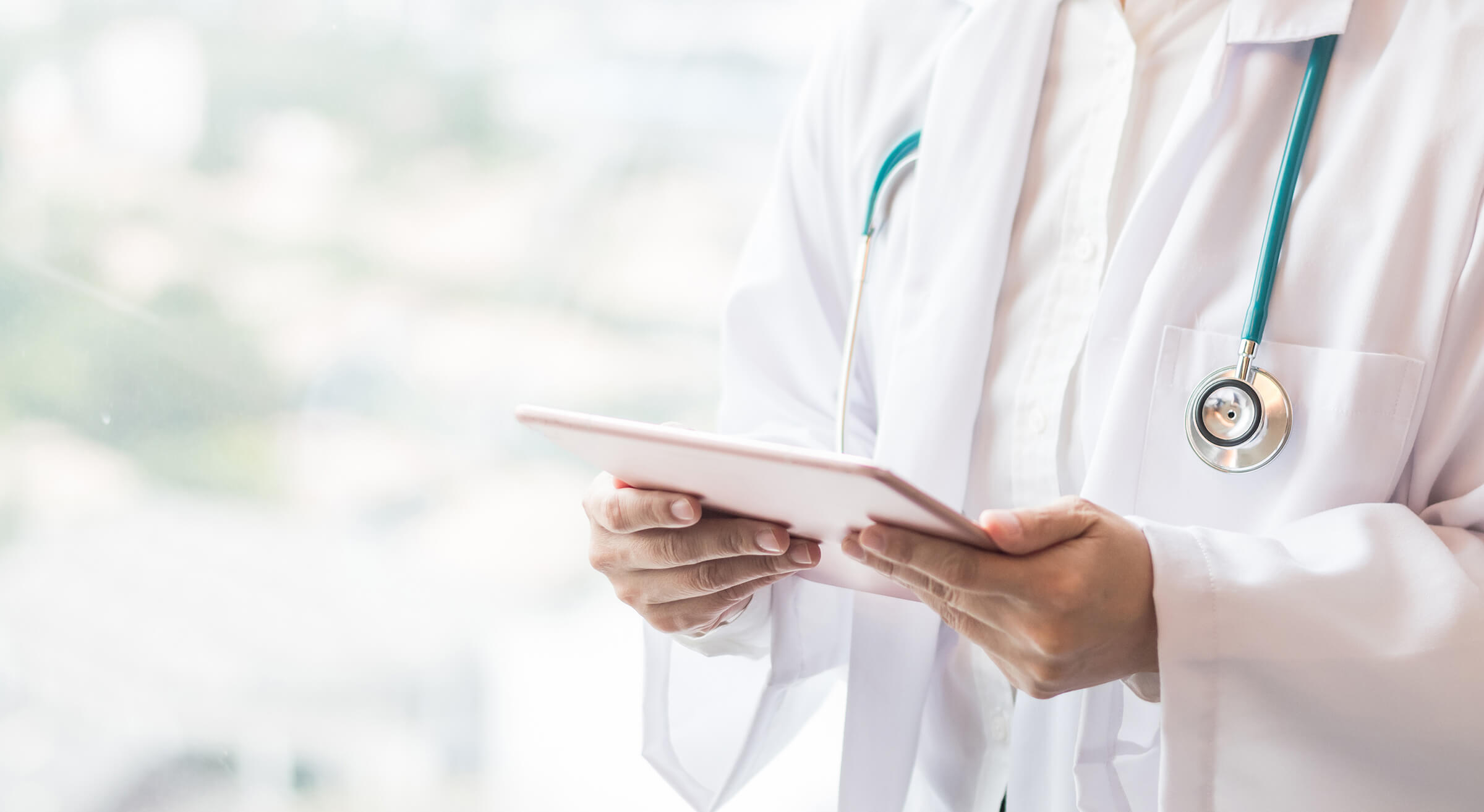 A doctor holding a clipboard